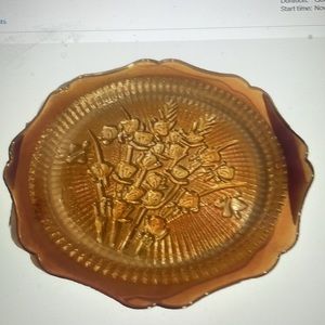 Vintage marigold glass carnival plate, 9.5”, pattern is “Bunch of Irises”